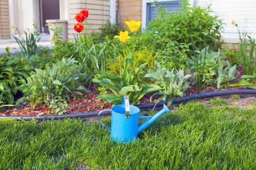 Professional Chessington gardeners improving a landscaped garden area